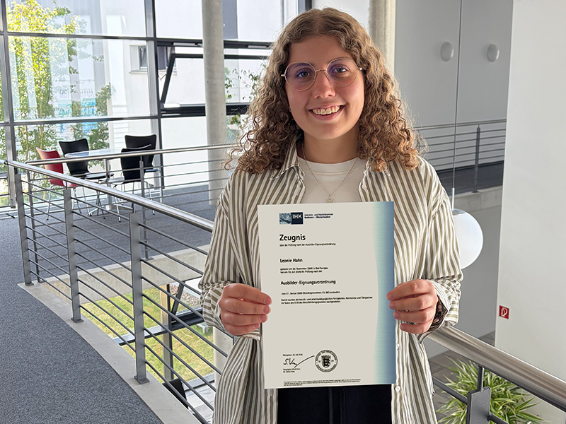 Leonie is shown with her certificate.